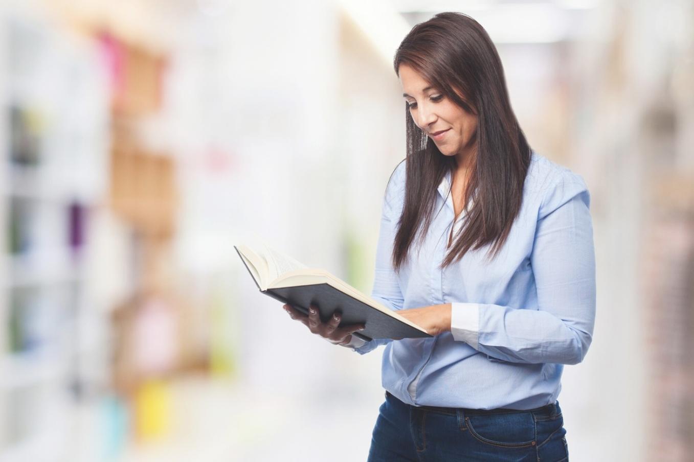 Students reviewing financial recovery materials in collaborative setting